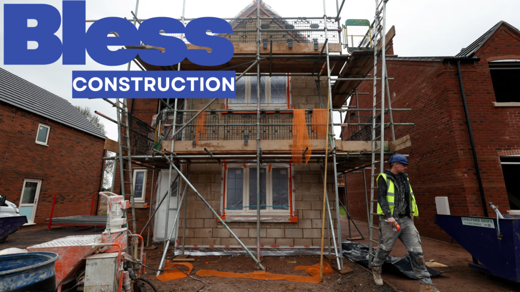 House building contractors working on construction site